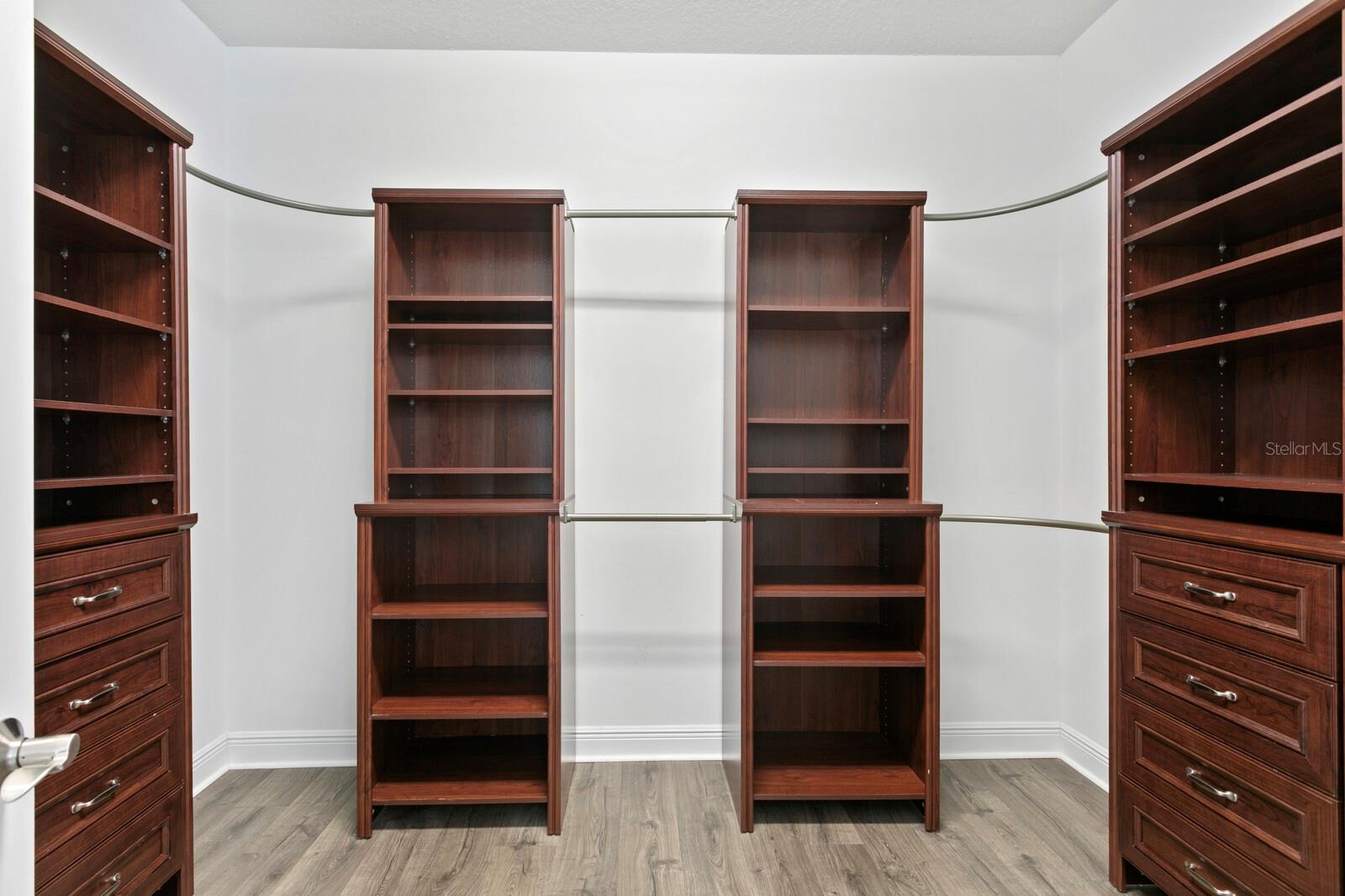 At the end of the master bath is the large walk-in-closet with custom organizing system