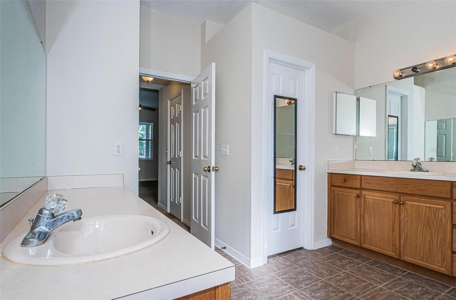 Master bathroom has dual sink areas.