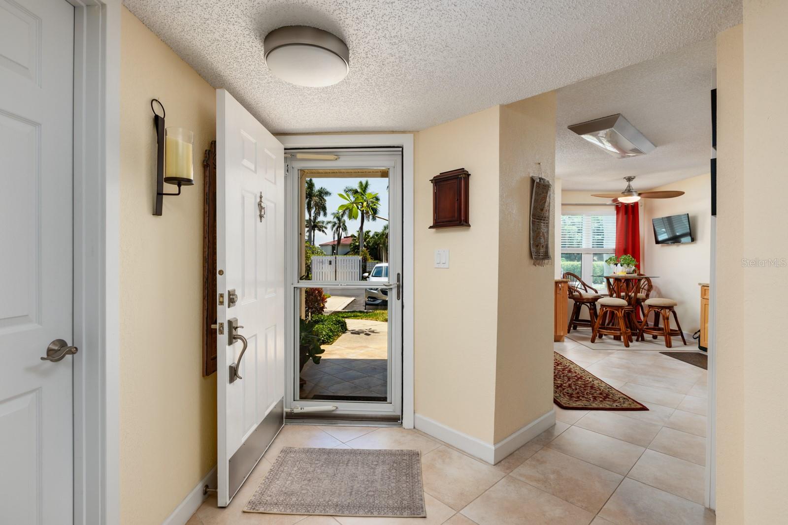 FOYER LEADS TO KITCHEN AREA AND LIVING AREA.