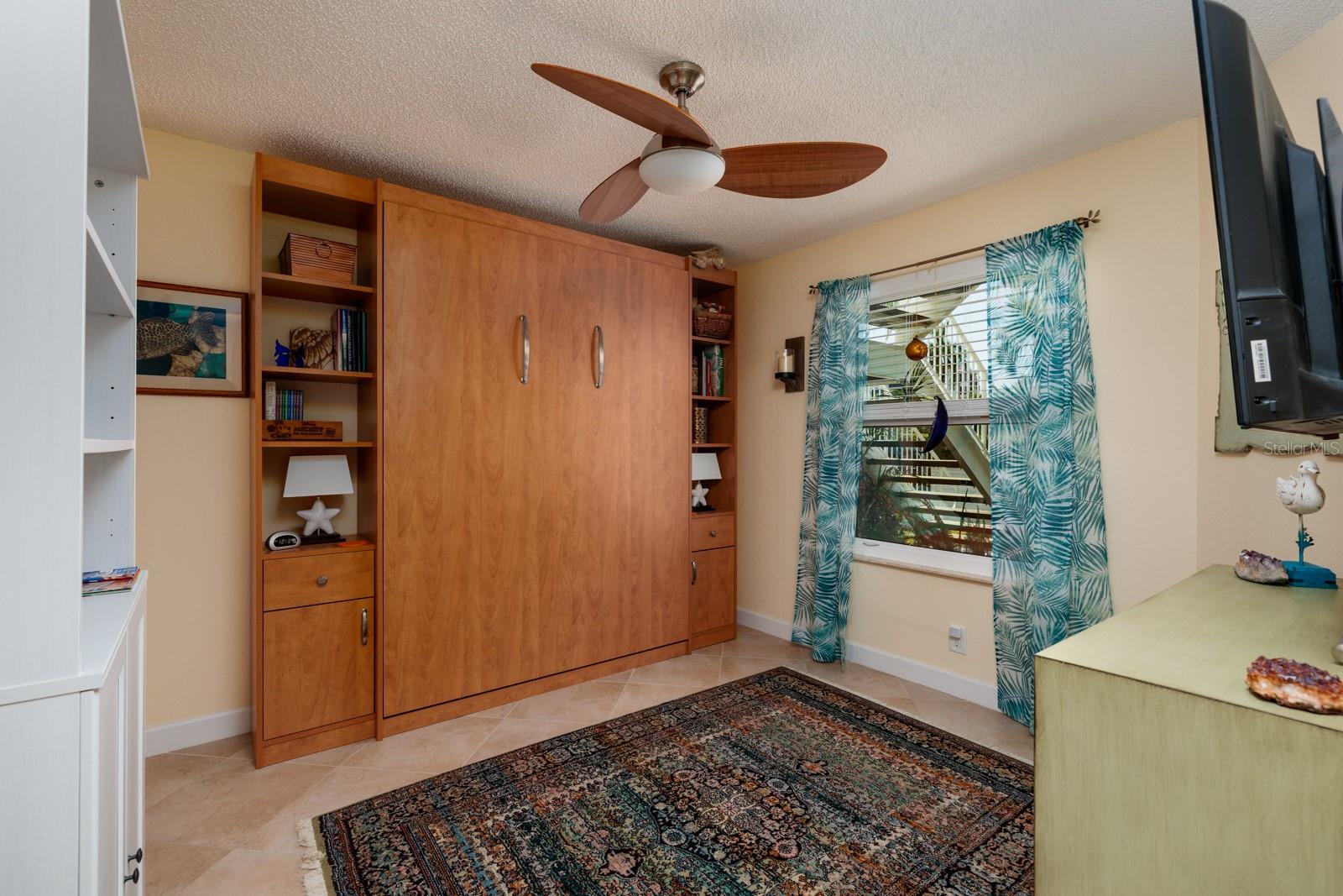 GUEST BEDROOM WITH MURPHY BED UP.