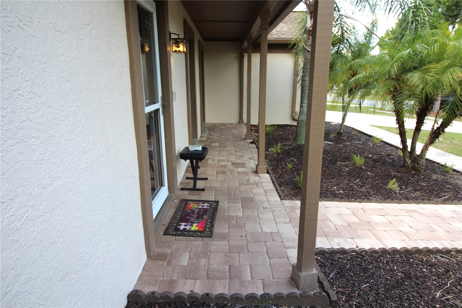 covered front porch with pavers