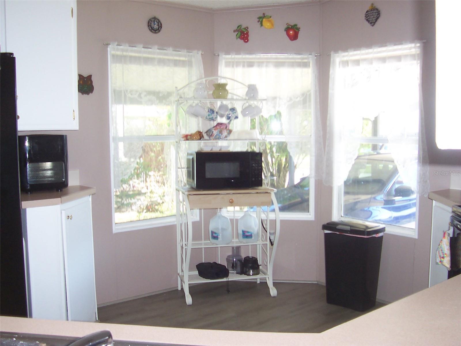 The 3 windows in the kitchen allow for natural light and would be a great place for a cafe table.