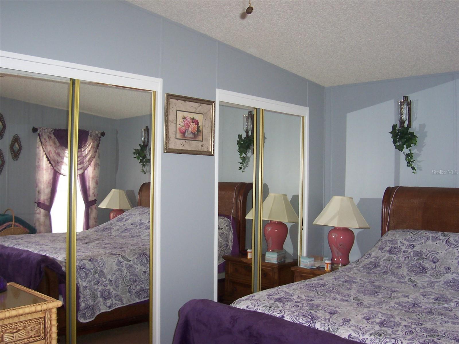 Dual mirrored closets provide ample closet space.