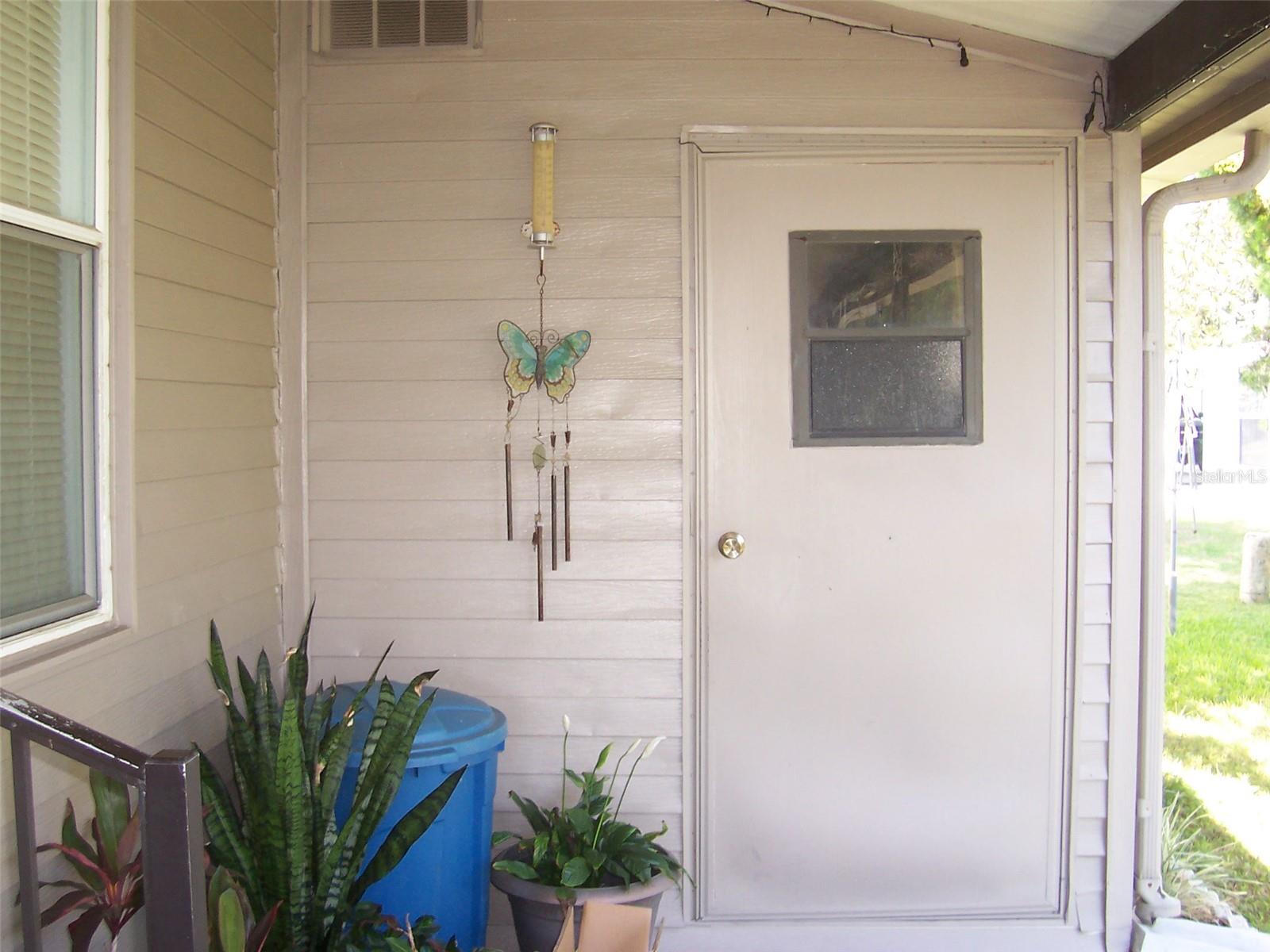 Attached shed features laundry area and storage!