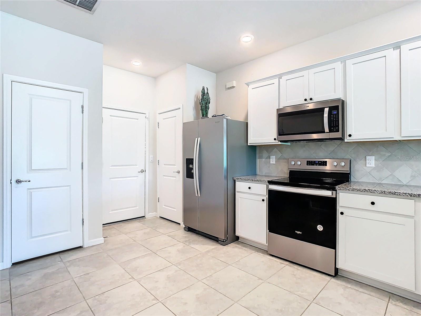 Additional kitchen storage and pantry in kitchen