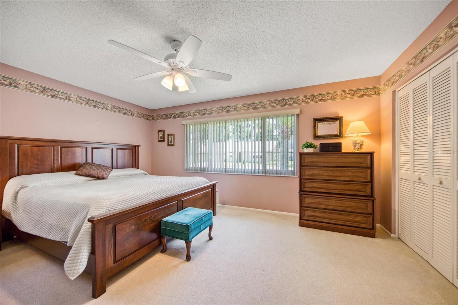 Spacious master bedroom with wall of closets~