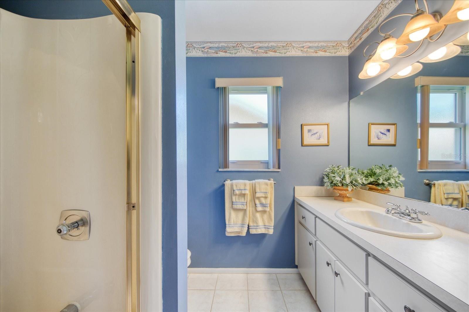 Guest bathroom in the hall with convenient vanity storage~