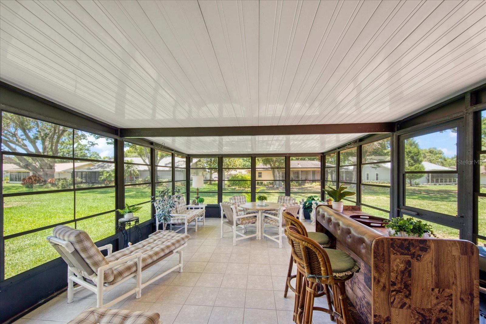 Large sunroom with tile flooring~