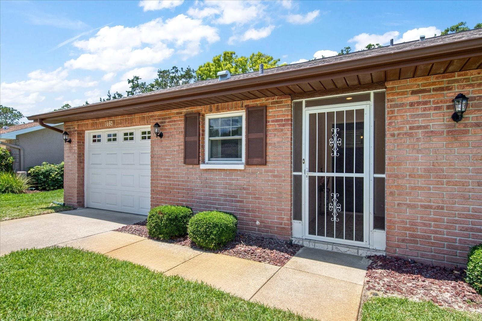 Newer roof, dual pane windows & impact door~