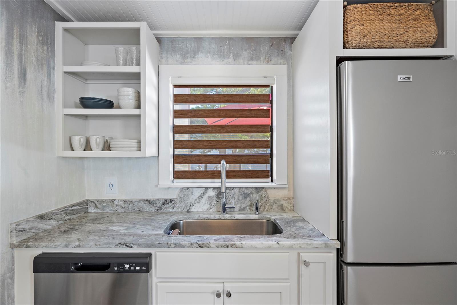 No detail has been overlooked, including Custom Painted wallpaper in the kitchen.