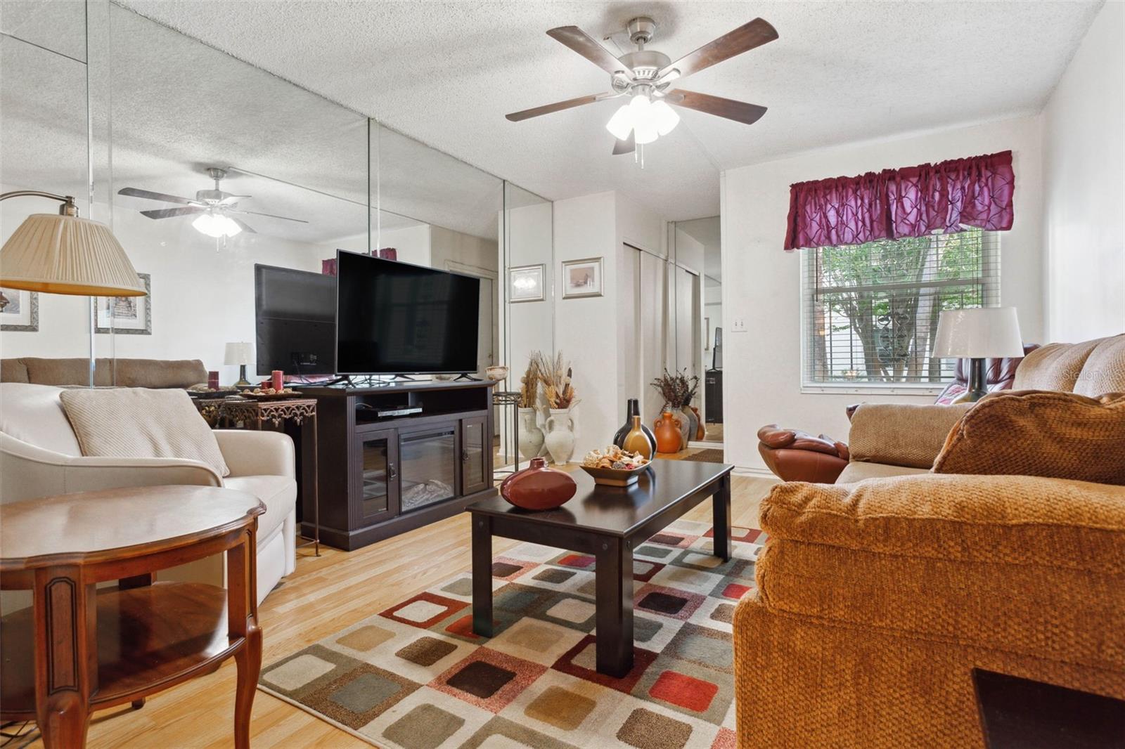 Living room with foyer and coat closet