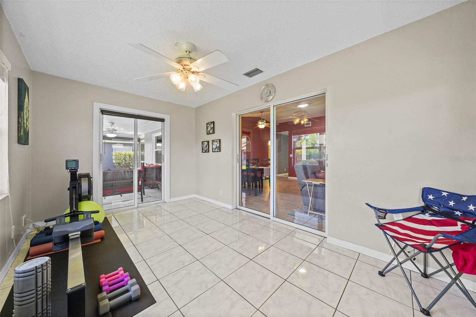 FLORIDA ROOM OPENS TO FAMILY ROOM AND LANAI