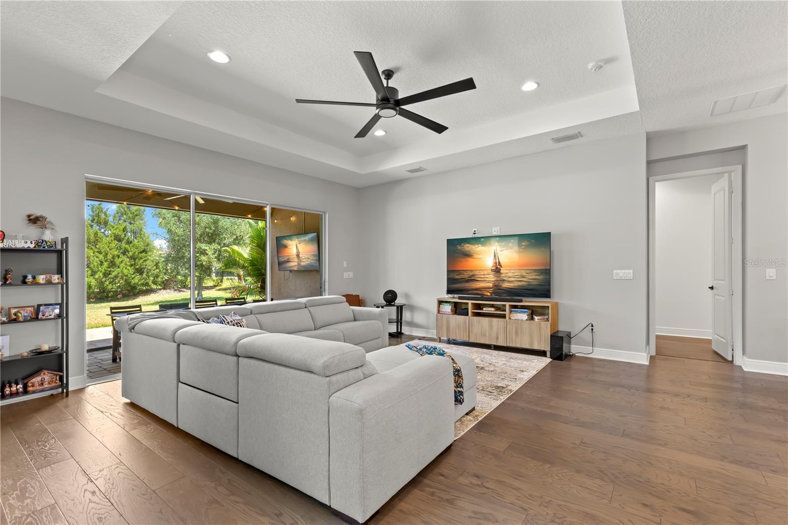 Loving the tray ceilings and rich engineered wood floors!