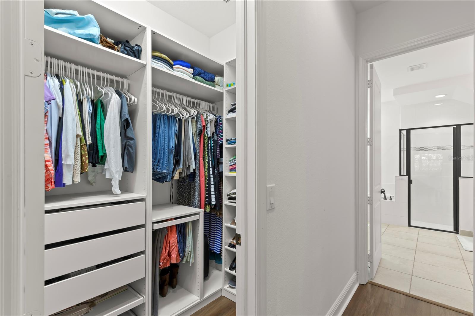 Two walk-in custom closets!