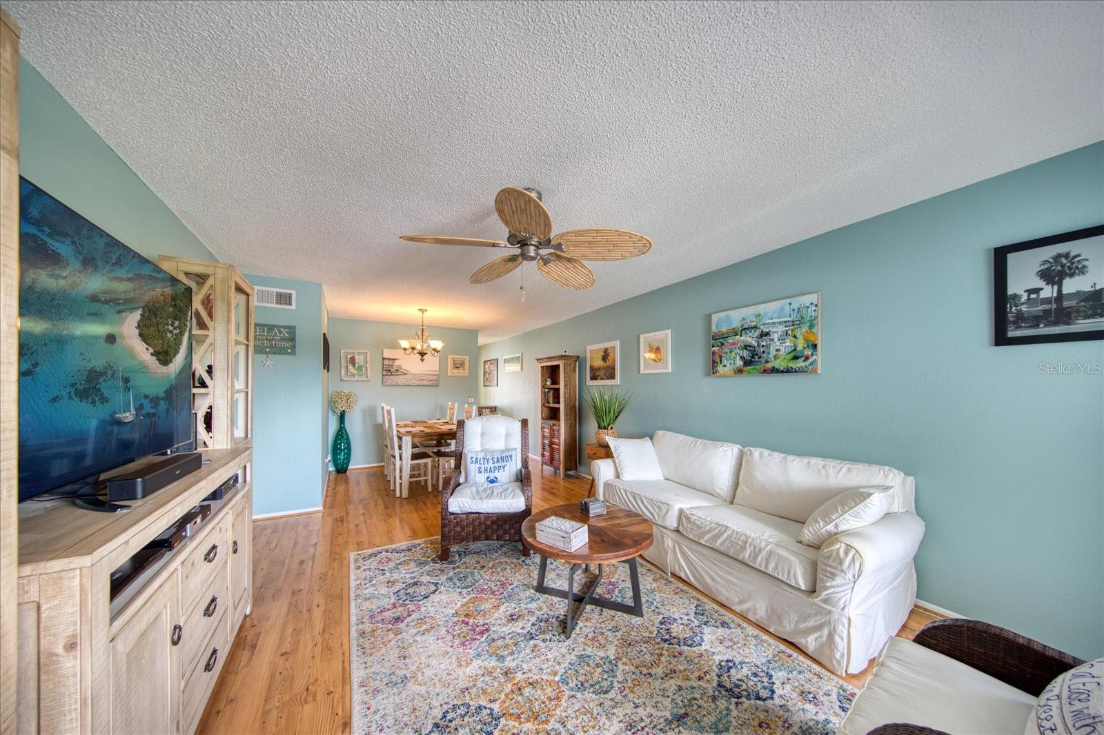 Living room/dining room combination with calming colors.