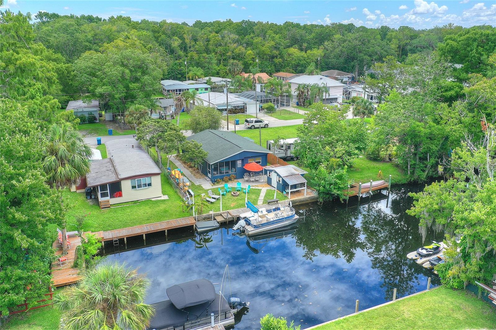 Ariel view of this move-in ready nature lovers waterfront home in this non-HOA neighborhood with no deed restrictions and conveniently located near local restaurant, shops, bars, outdoor activities and much more!