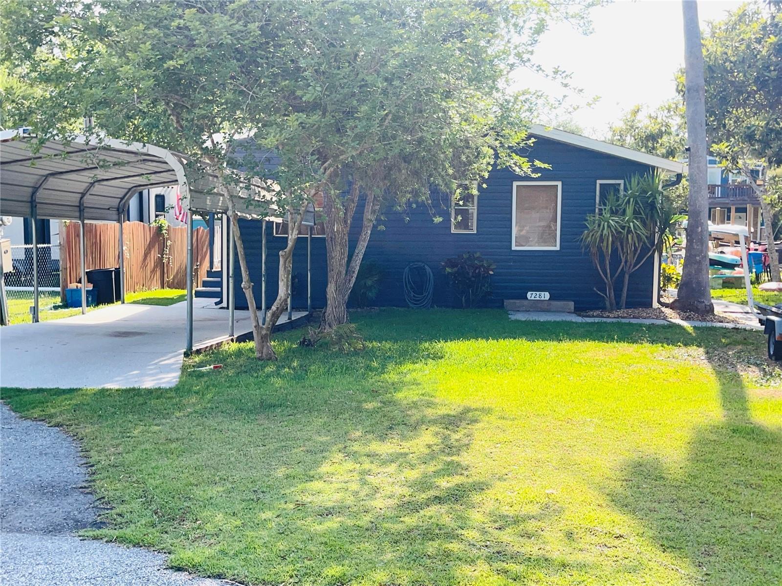 Front of home with covered parking