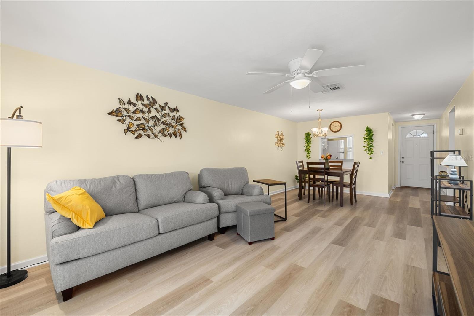 Living room features a ceiling fan, and the dining room features a tasteful chandelier. Furniture is newer and neutral!  Just bring your clothes and move right in!