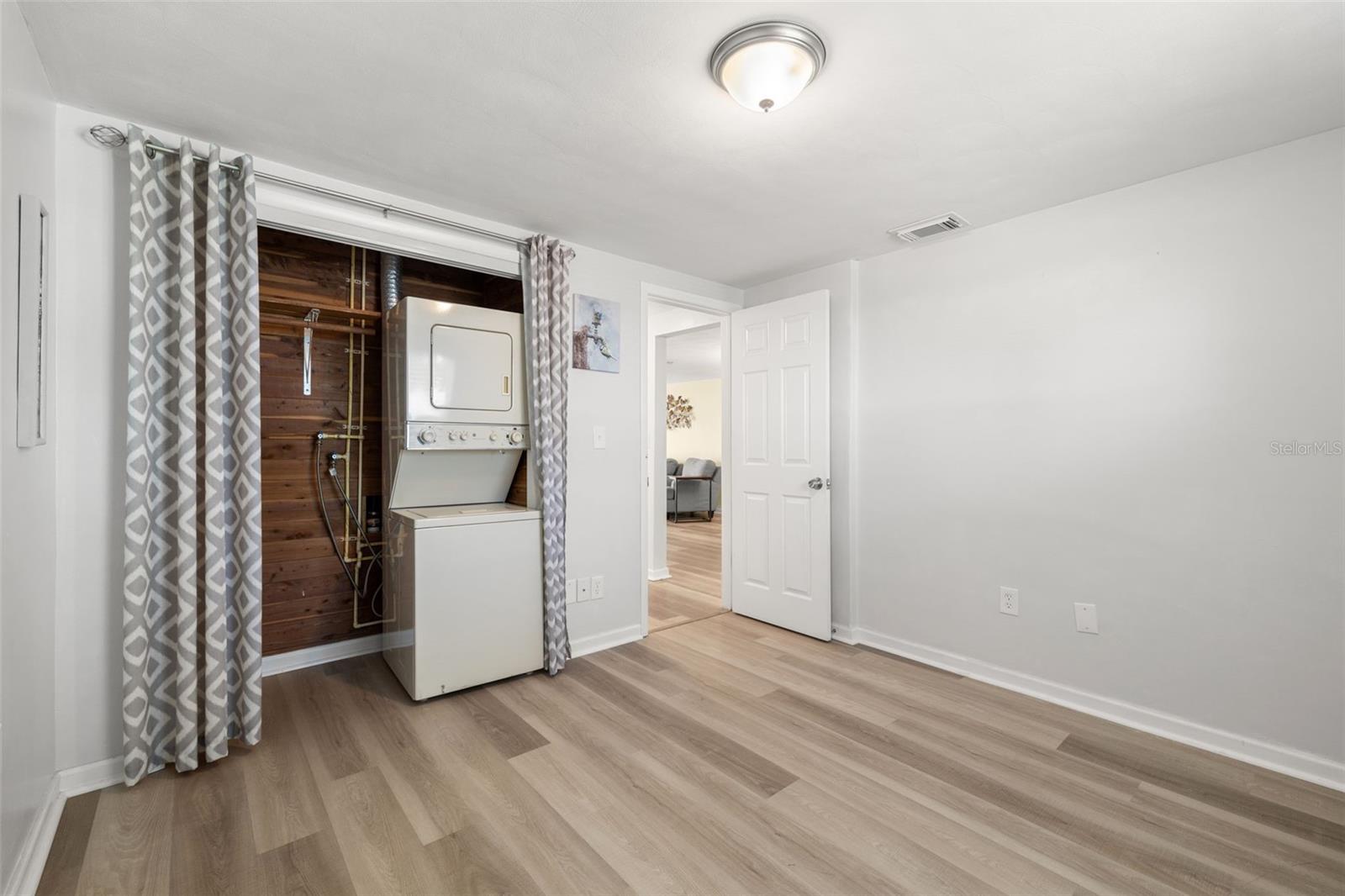 The front bedroom includes a cedar closet, as well as the stackable washer & dryer.