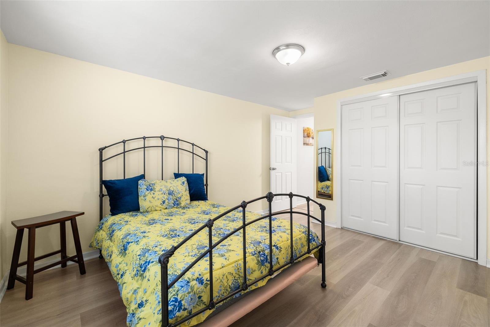 2nd bedroom at the rear of the home also features a cedar closet, luxury vinyl flooring and on-trend, neutral paint colors.