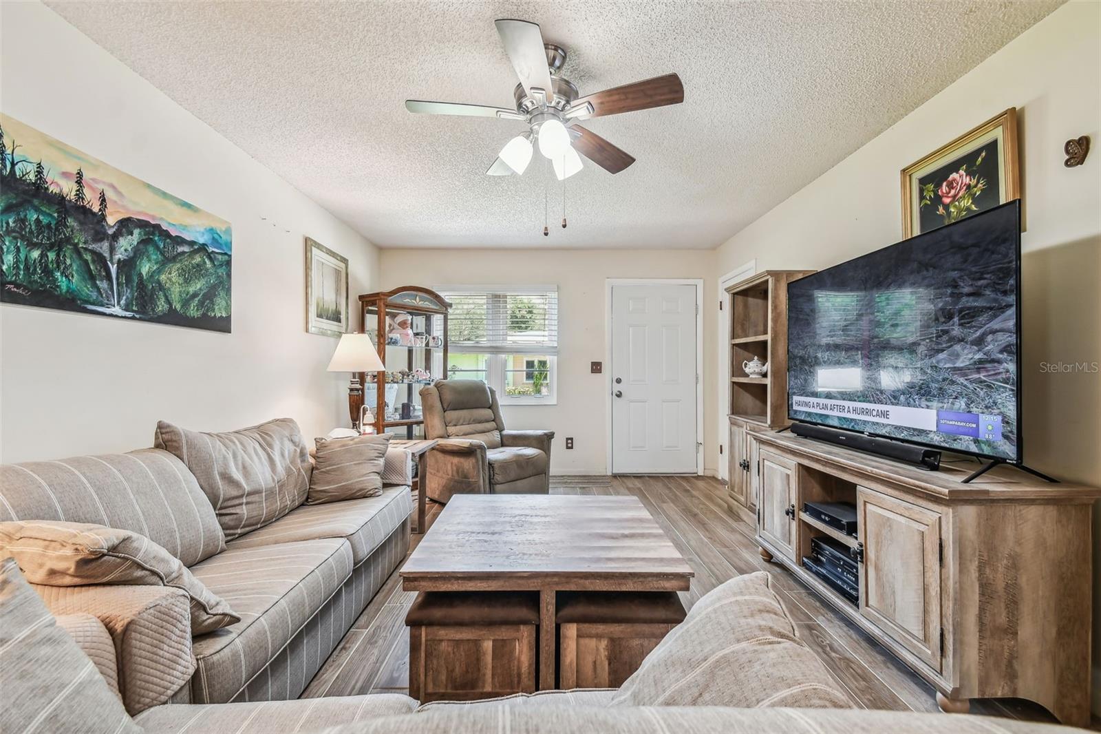 Neutral walls and natural light throughout living area