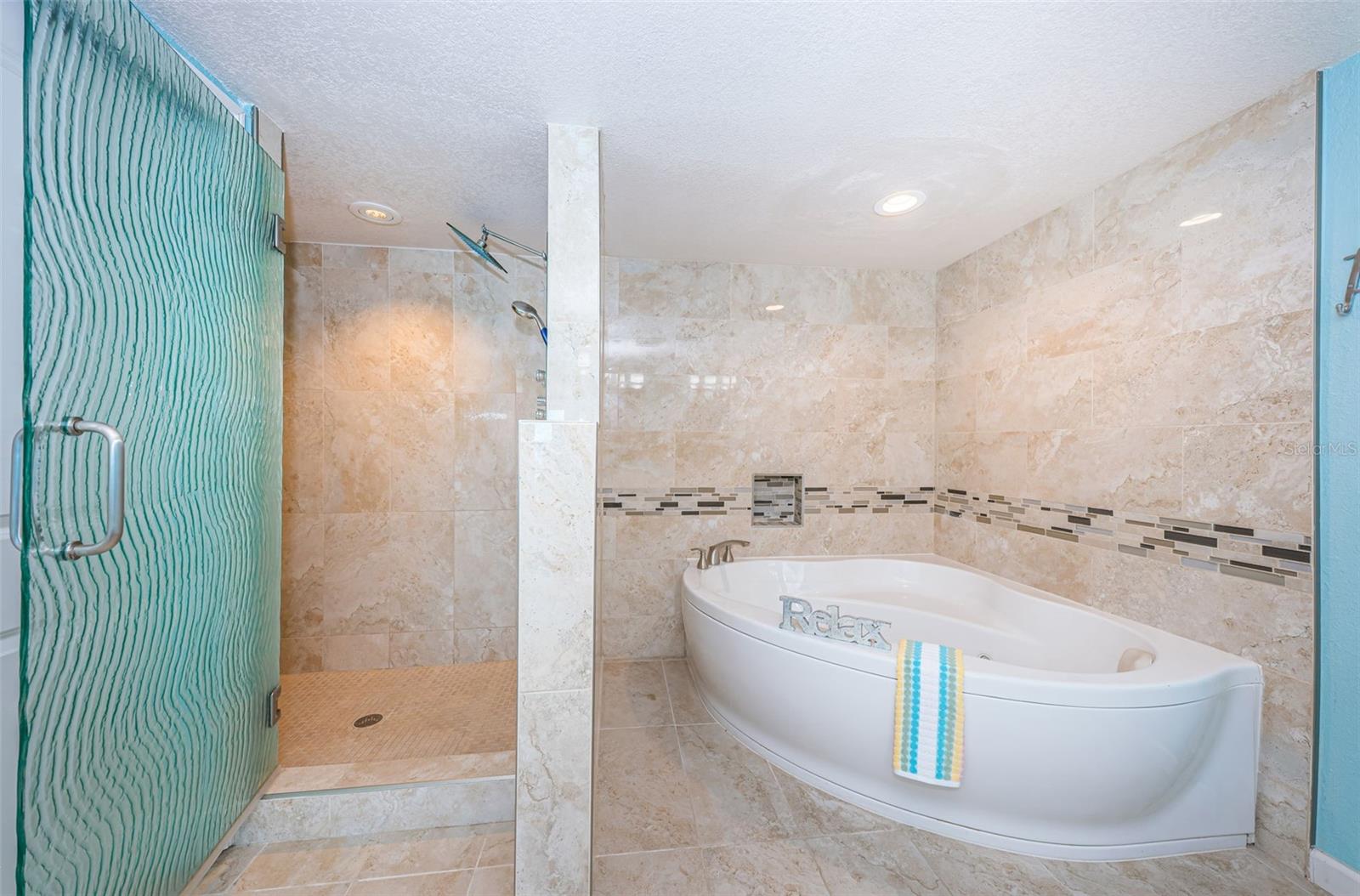 ... One Party Wanted a Walk in Shower - The Other Party Wanted a Spa Soaking Tub.. Answer was to Combine & Remodel Two Rooms and Keep Peace in the Household.. Walk In Shower to the Left and Soaking  Spa Tub  to the Right..