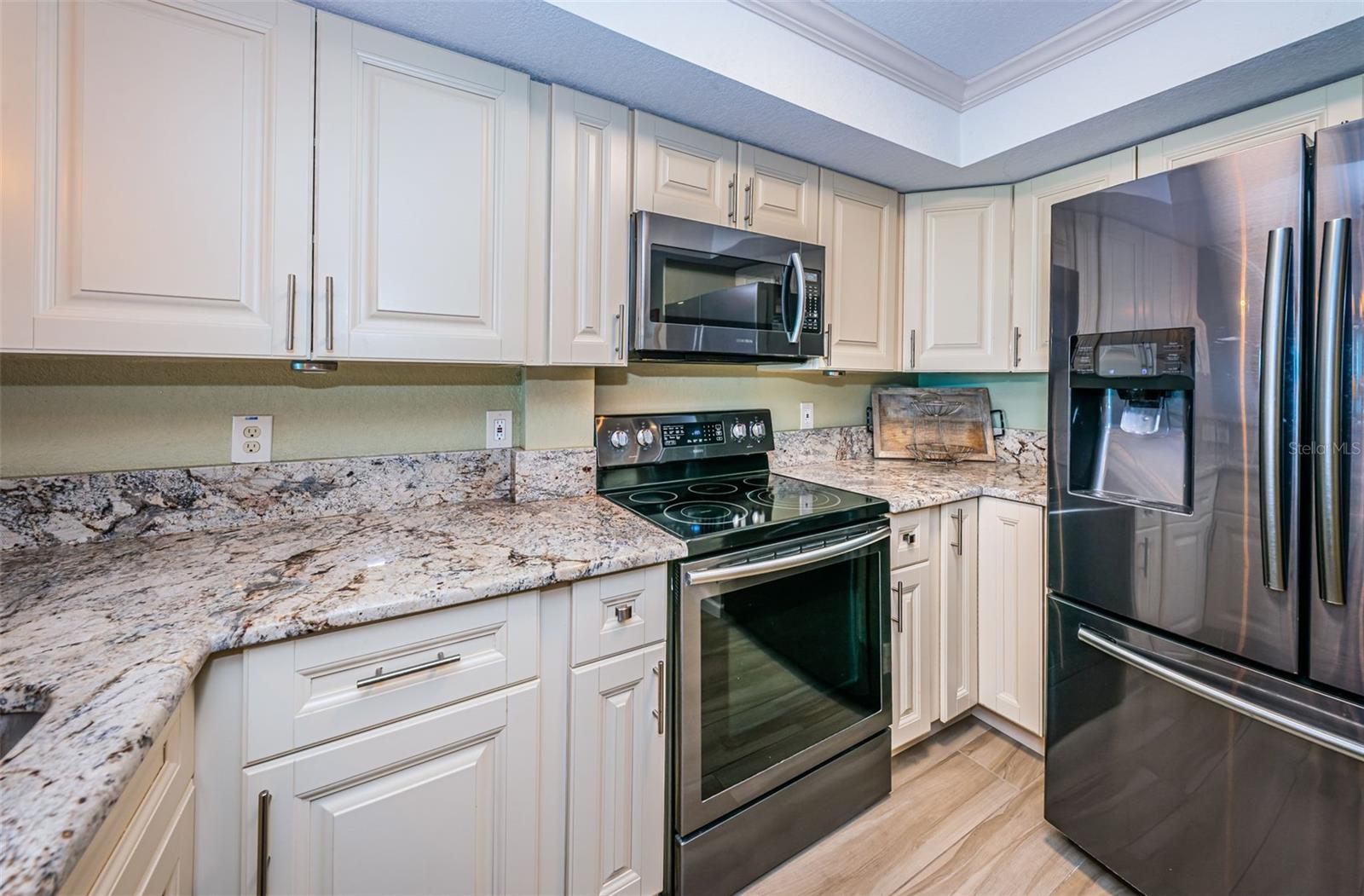 ,.. Kitchen - Solid Wood Cabinetry - Granite Countertops - Stainless Appliance Package - Etc.. Sellers even Installed ALL NEW - IN WALL  - Plumbing Pipes  with new Kitchen.
