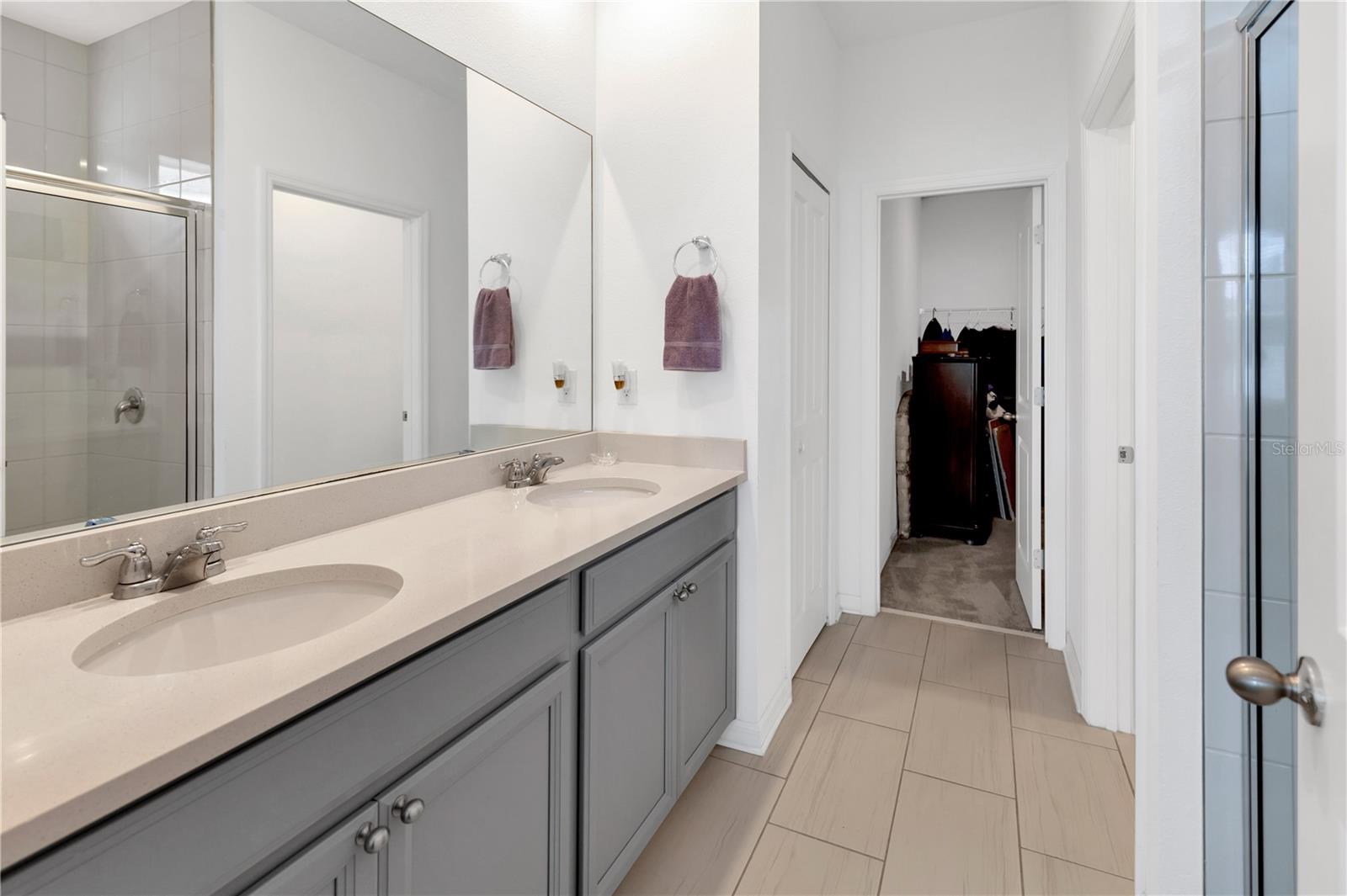 Double vanity,  large walk-in shower and separate water closet to the right