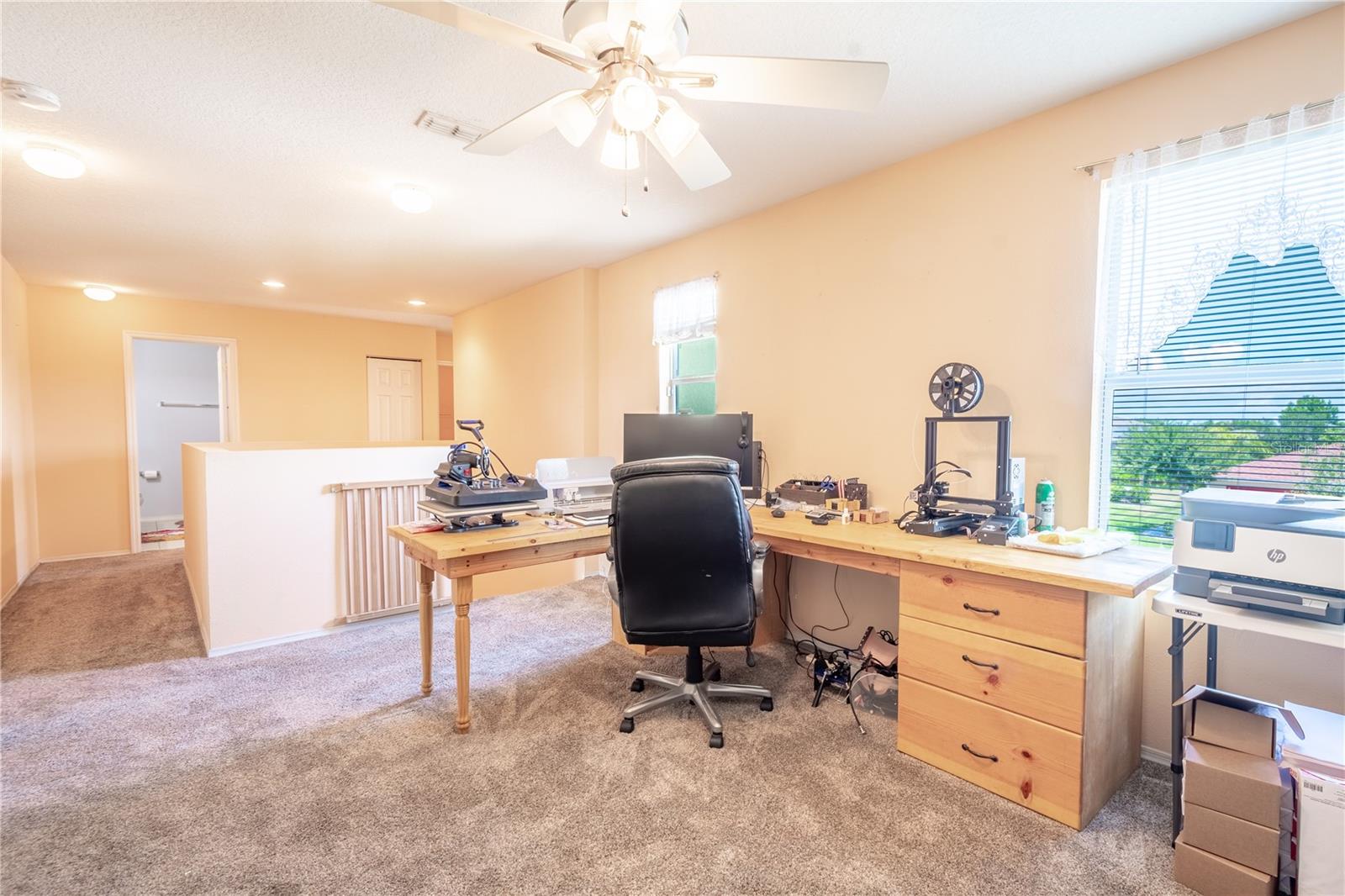 The upstairs loft is ideal for an office, a TV or game room, or playroom.