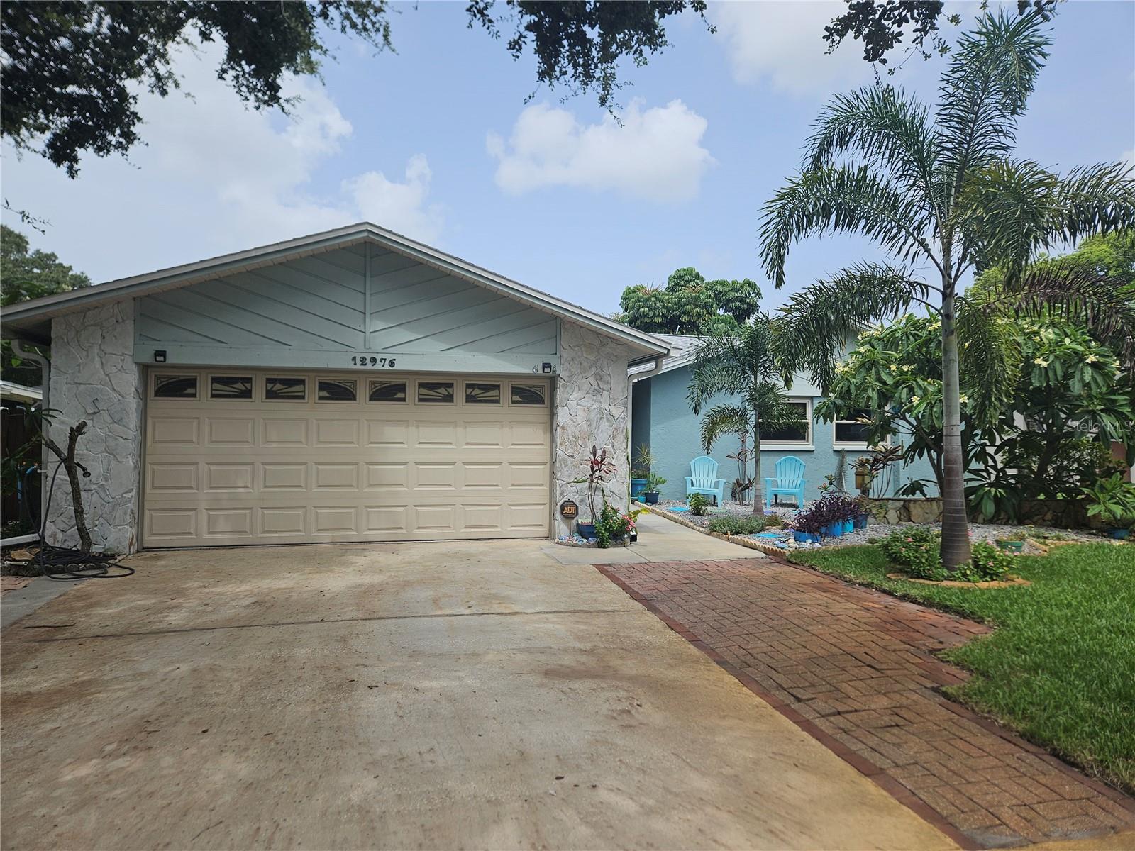 Front of Home with 2 Car Garage, sitting area, NEW Sod