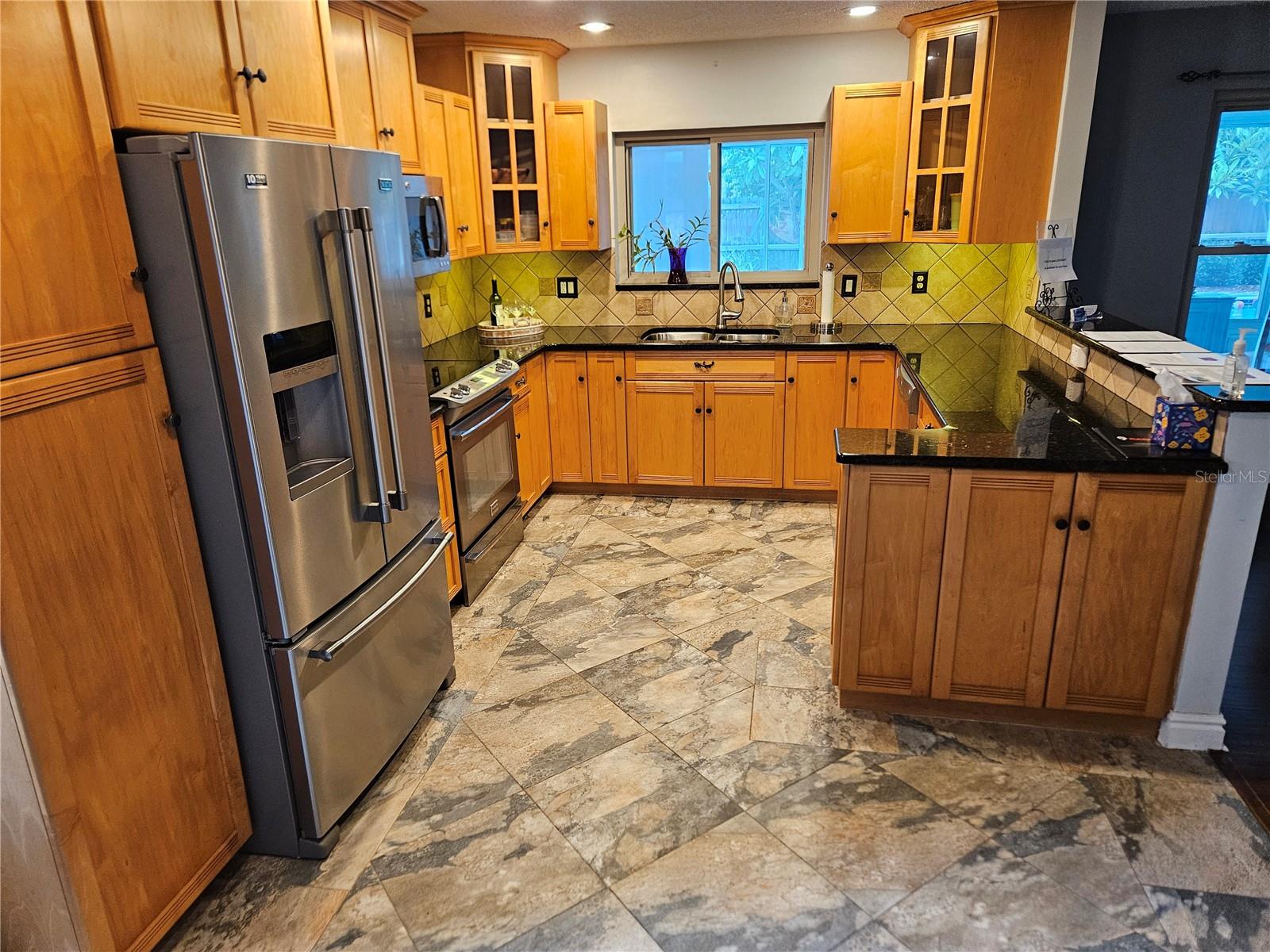 Kitchen with window overlooking Florida Room and Pool