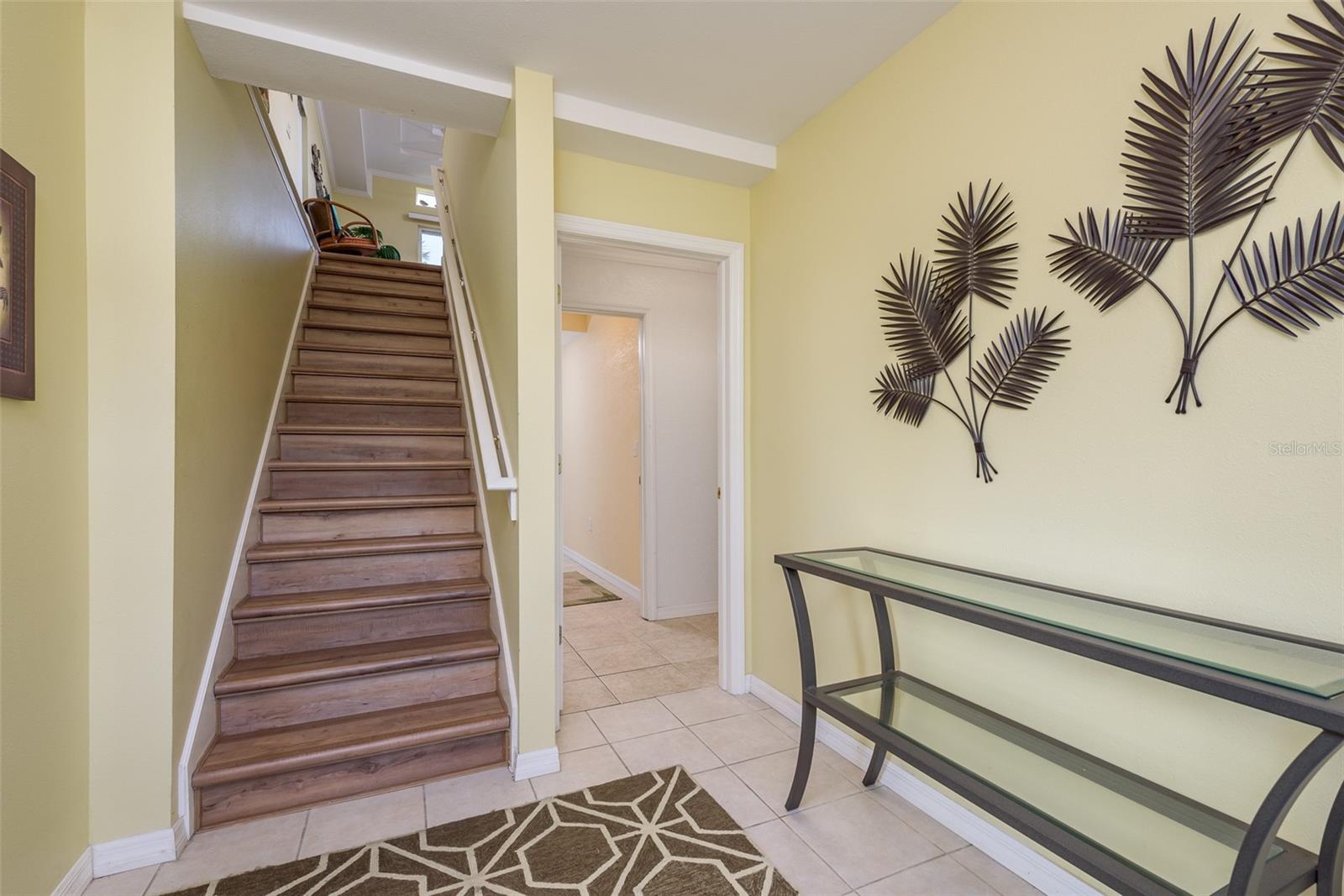 Foyer to stairway to upper level