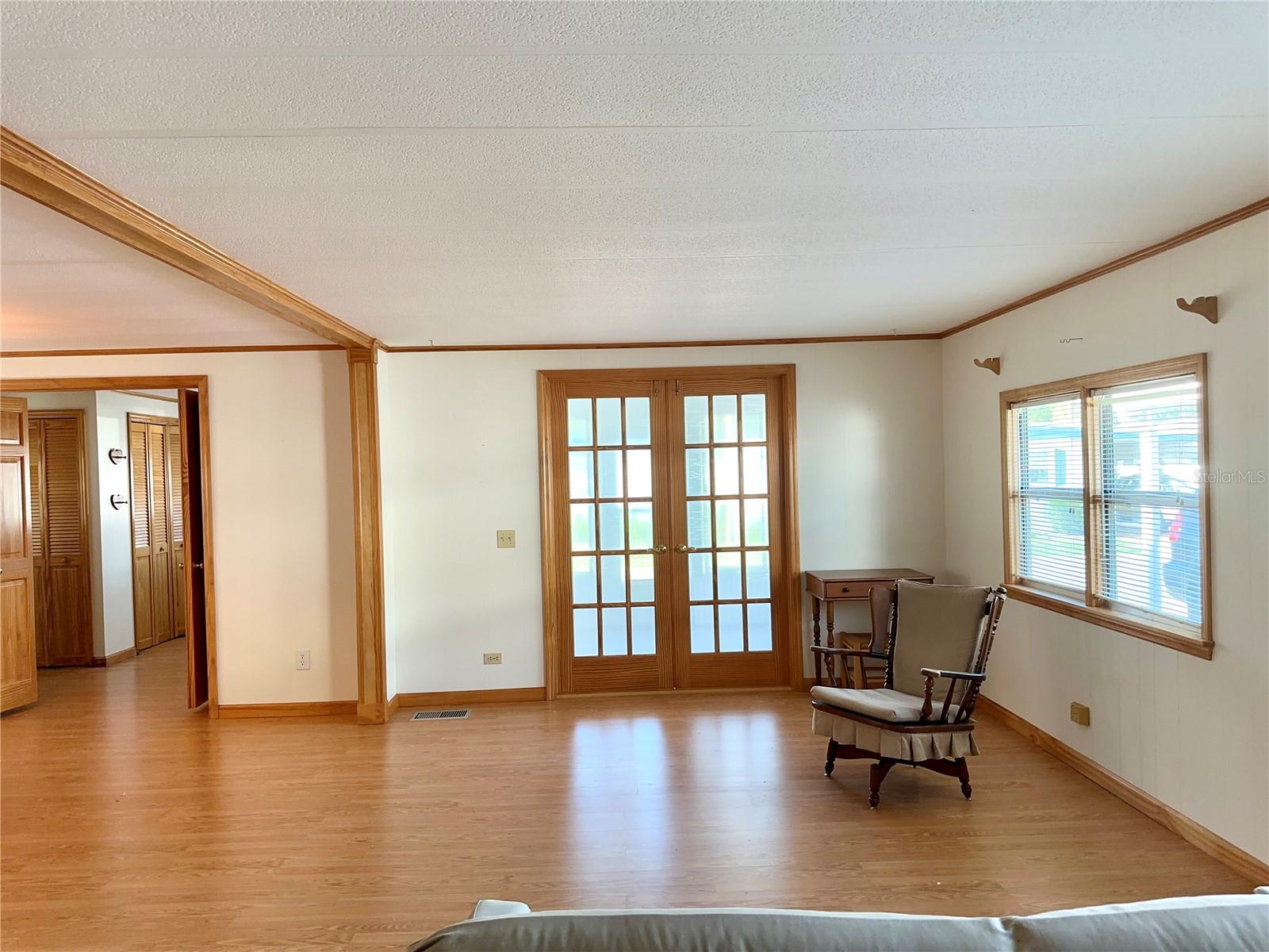 Living Room looking toward french doors to screened porch