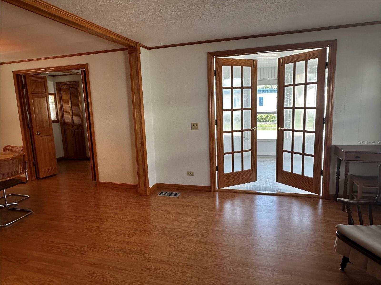 Entrances to the front covered patio and the 3rd bedroom