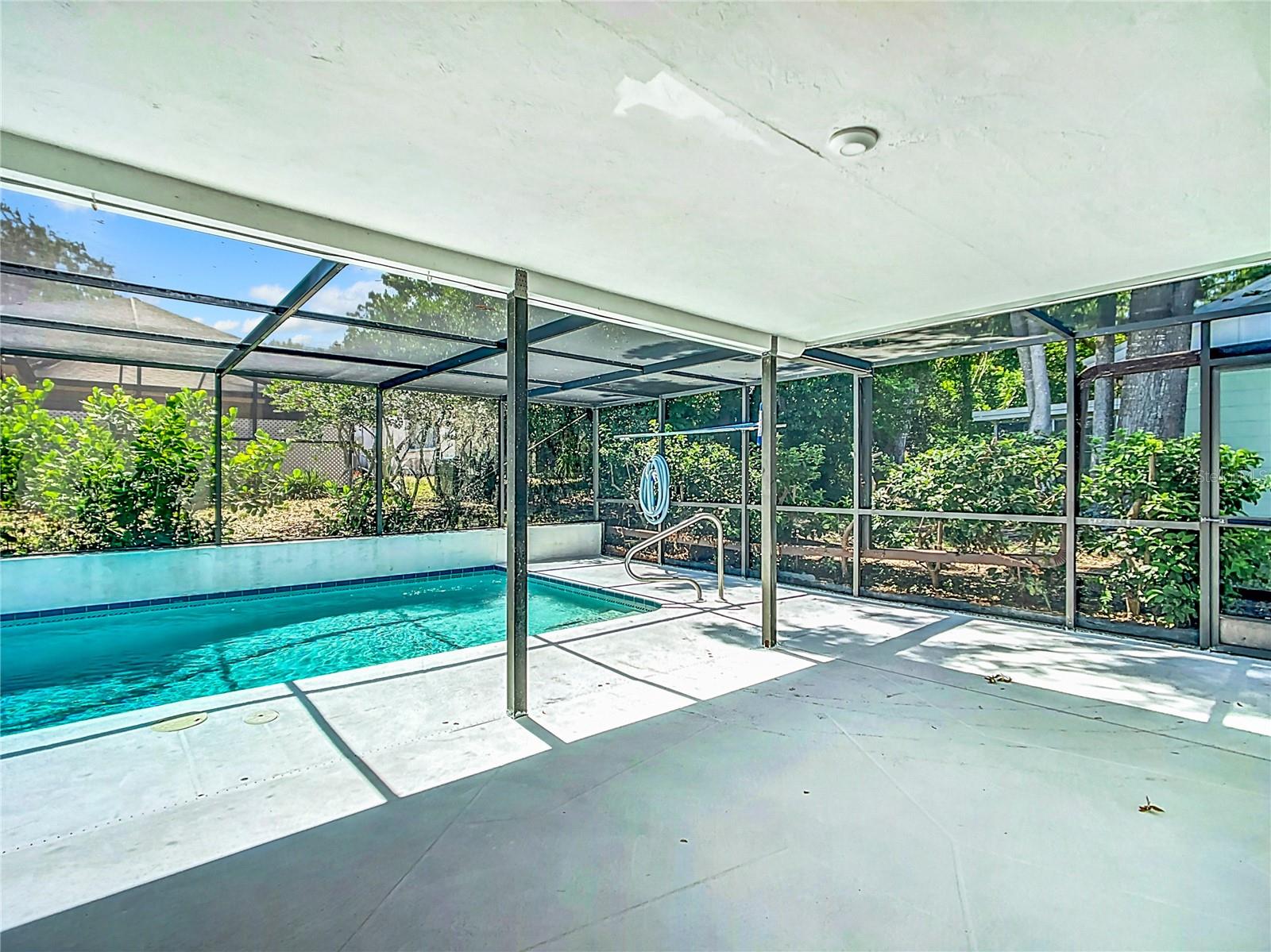 Covered rear patio by pool