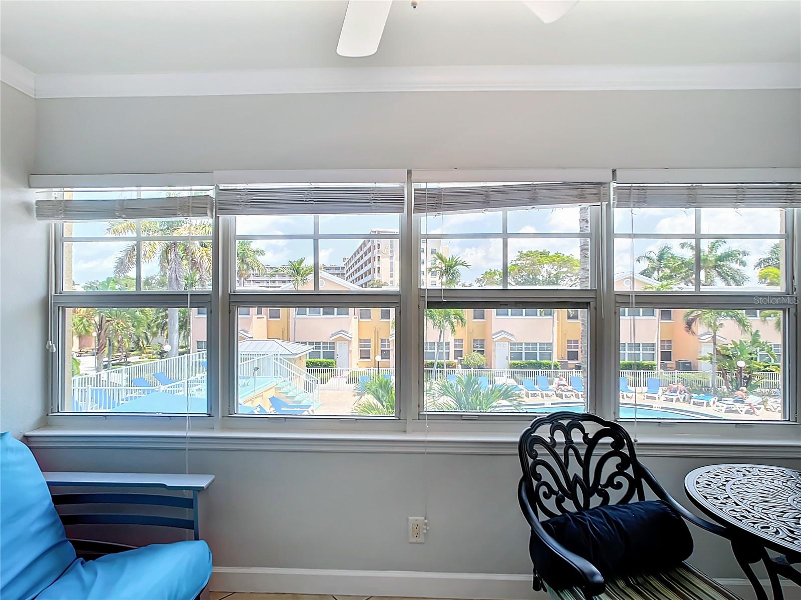 Sunroom with resort pool and intercoastal views