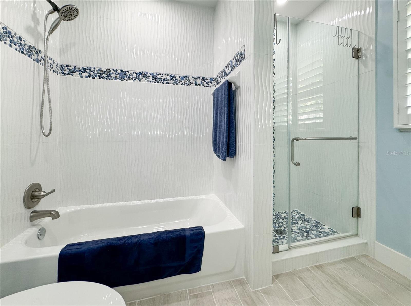 Guest Bathroom with a Bathtub and a Shower