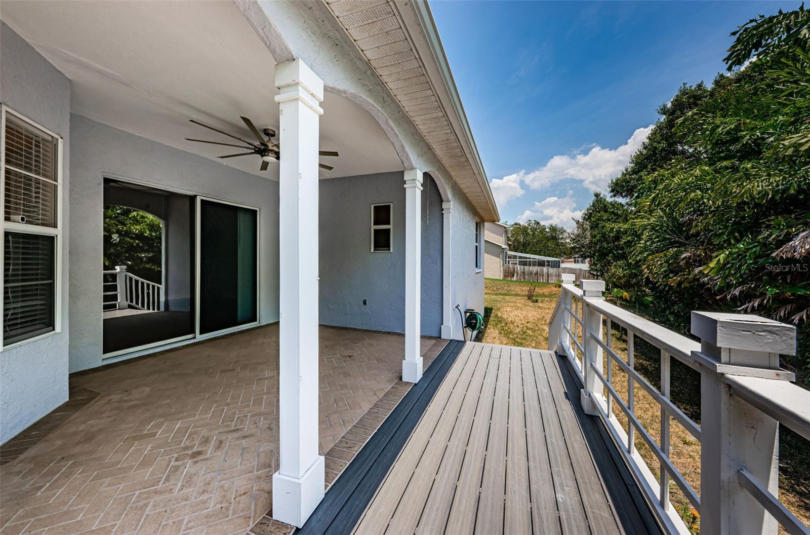 Pack porch with steps that lead to back yard