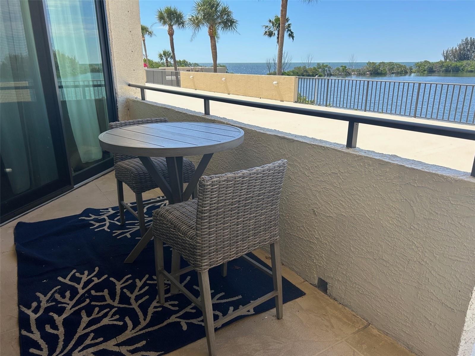 Step outside the condo onto the balcony/patio to enjoy the incomparable beauty of having the Gulf of Mexico right outside your door.  This view includes marine life, boats of all types, water fowl and sunsets  to die for.