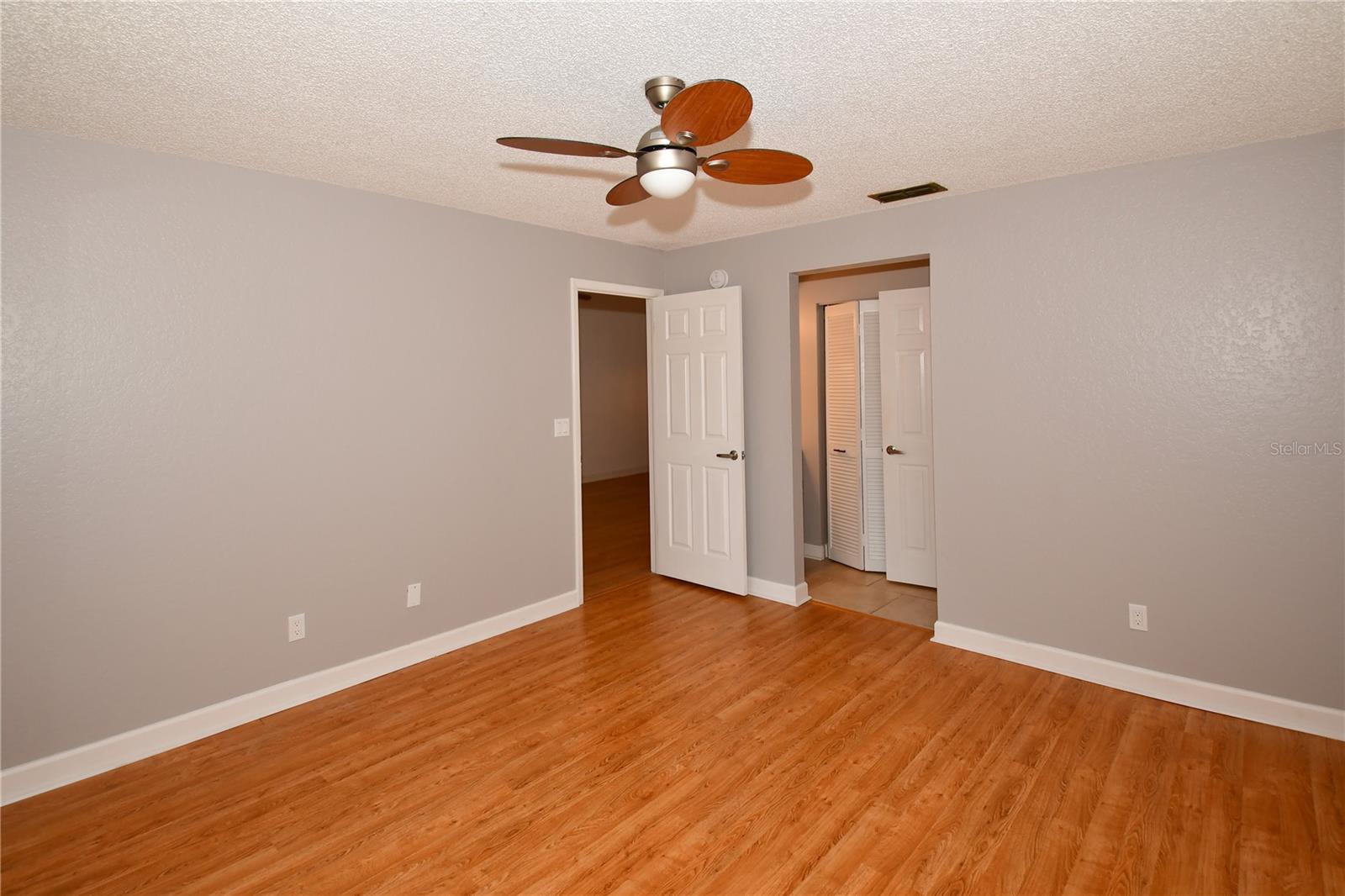 Primary Bedroom with walk in closet and ensuite bathroom