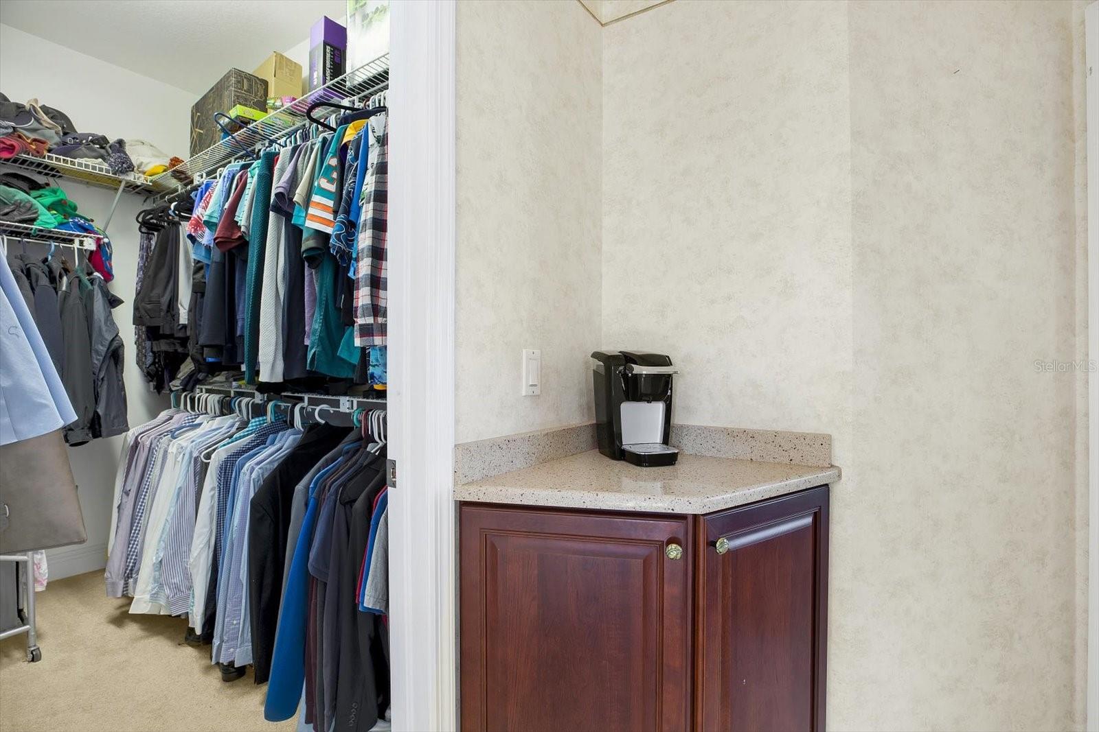 His- one of two walk-in closets located off the primary bath