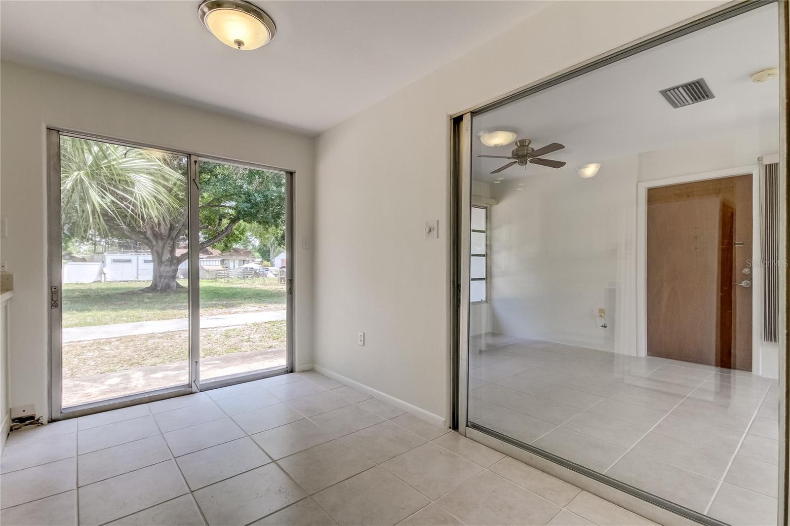 Dining area looking out into large backyard and sun room / bonus room