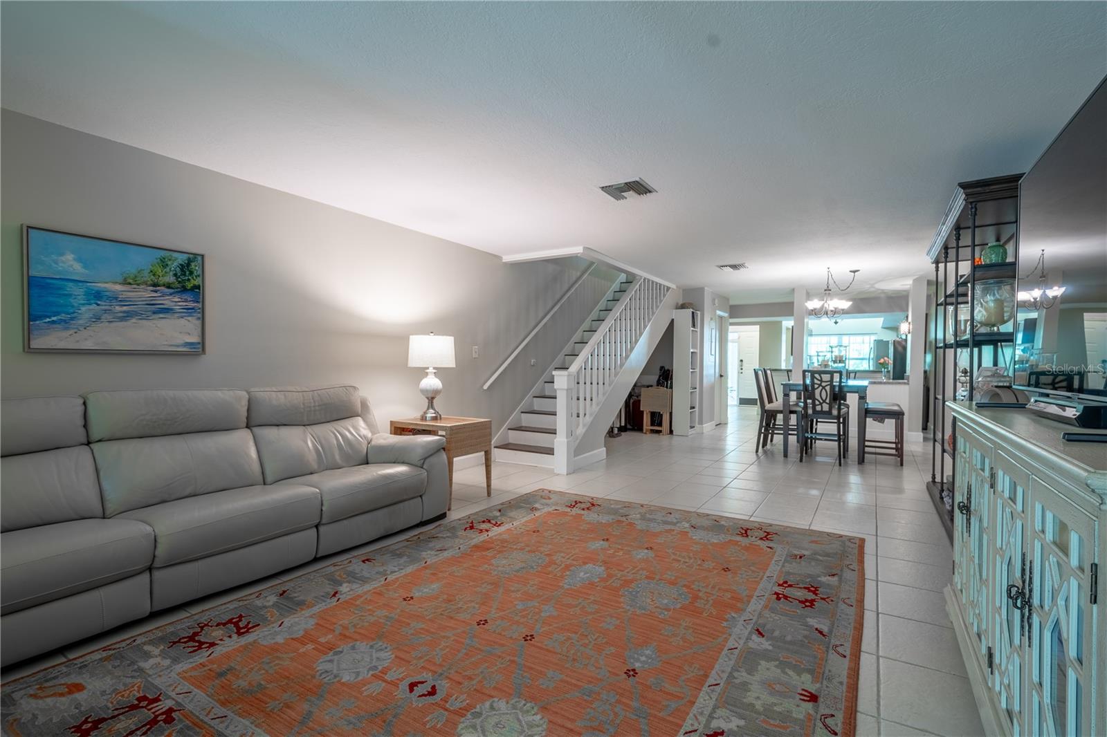 A beautiful wood banister leads to the 2nd floor bedrooms and baths.