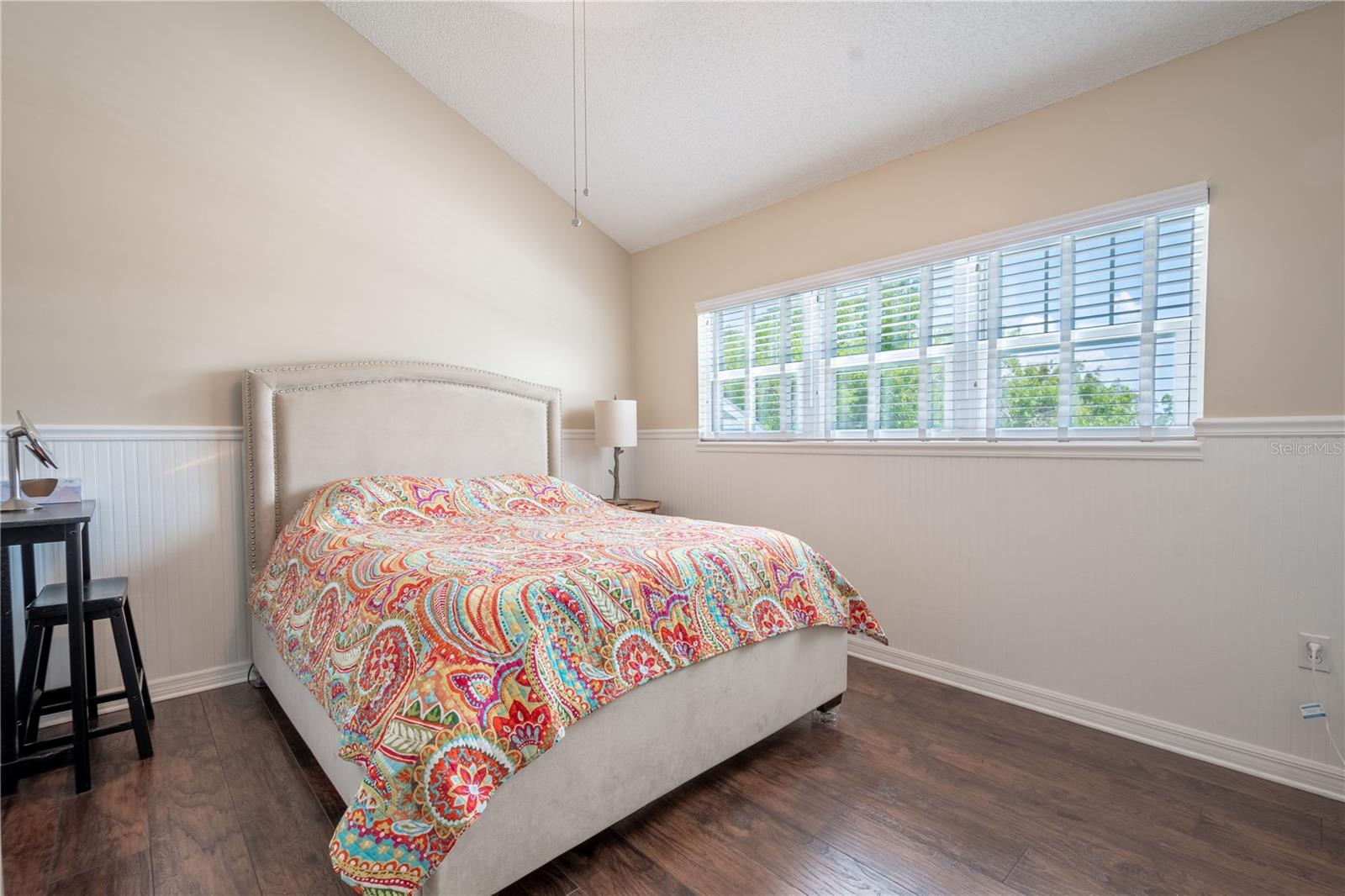 Bedroom 2 is a spacious 11x13, and features wainscoting with chair rail.