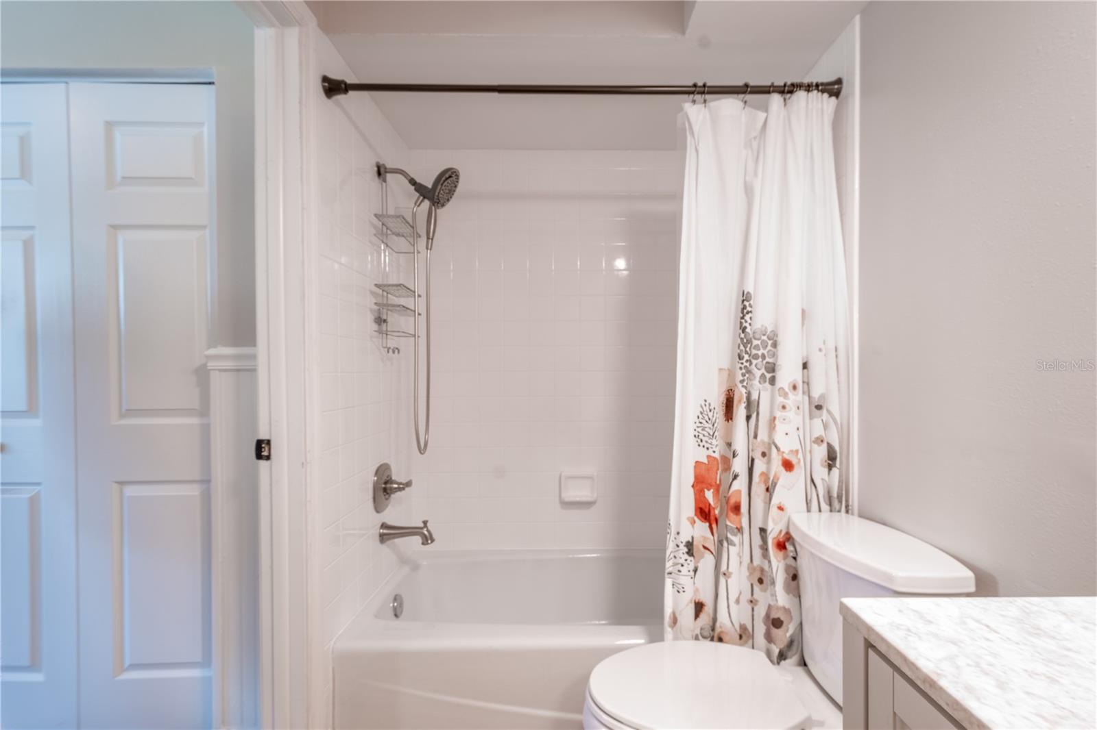 The 2nd bedroom ensuite features a tub with shower.