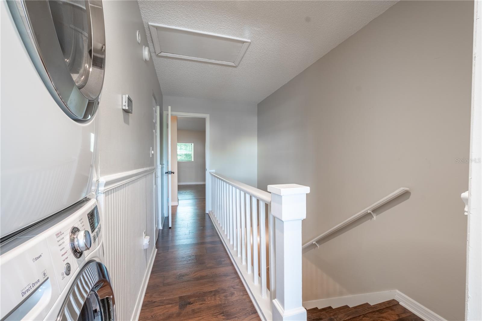 The upstairs hall features vinyl (wood plank) flooring.