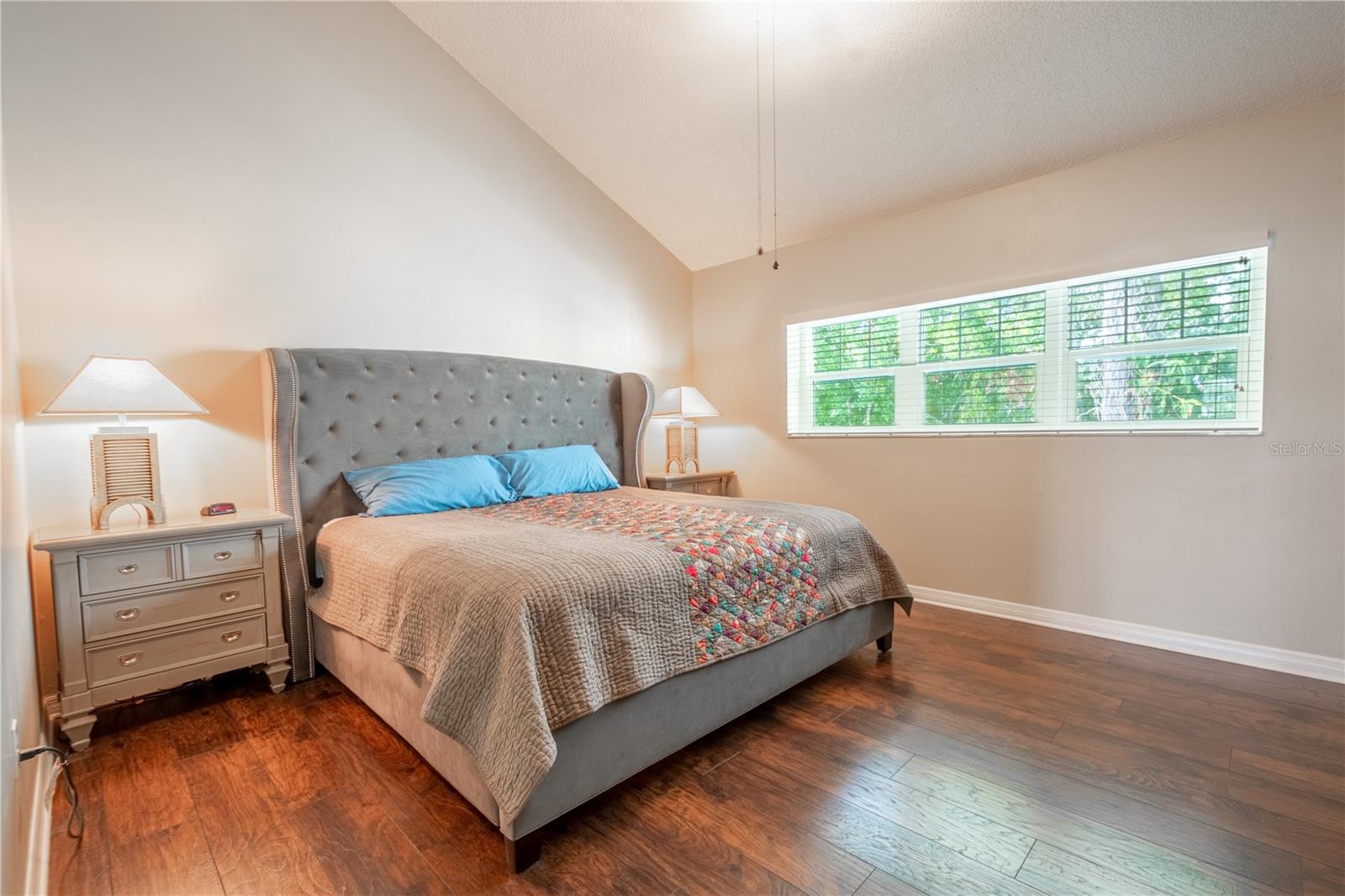 Vaulted ceiling create a lofty, airy feel.