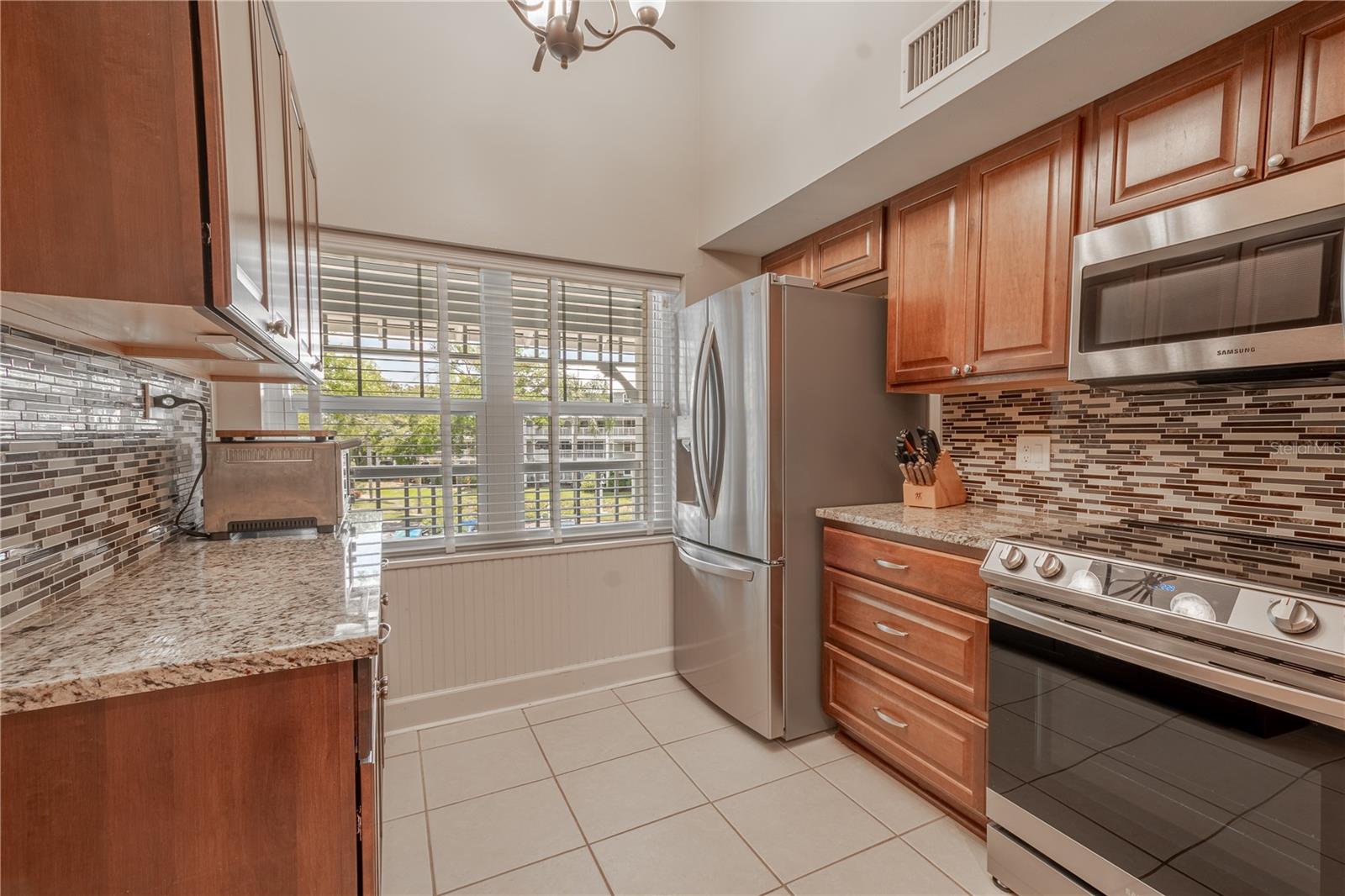 A Large kitchen window allows for plenty of natural light.