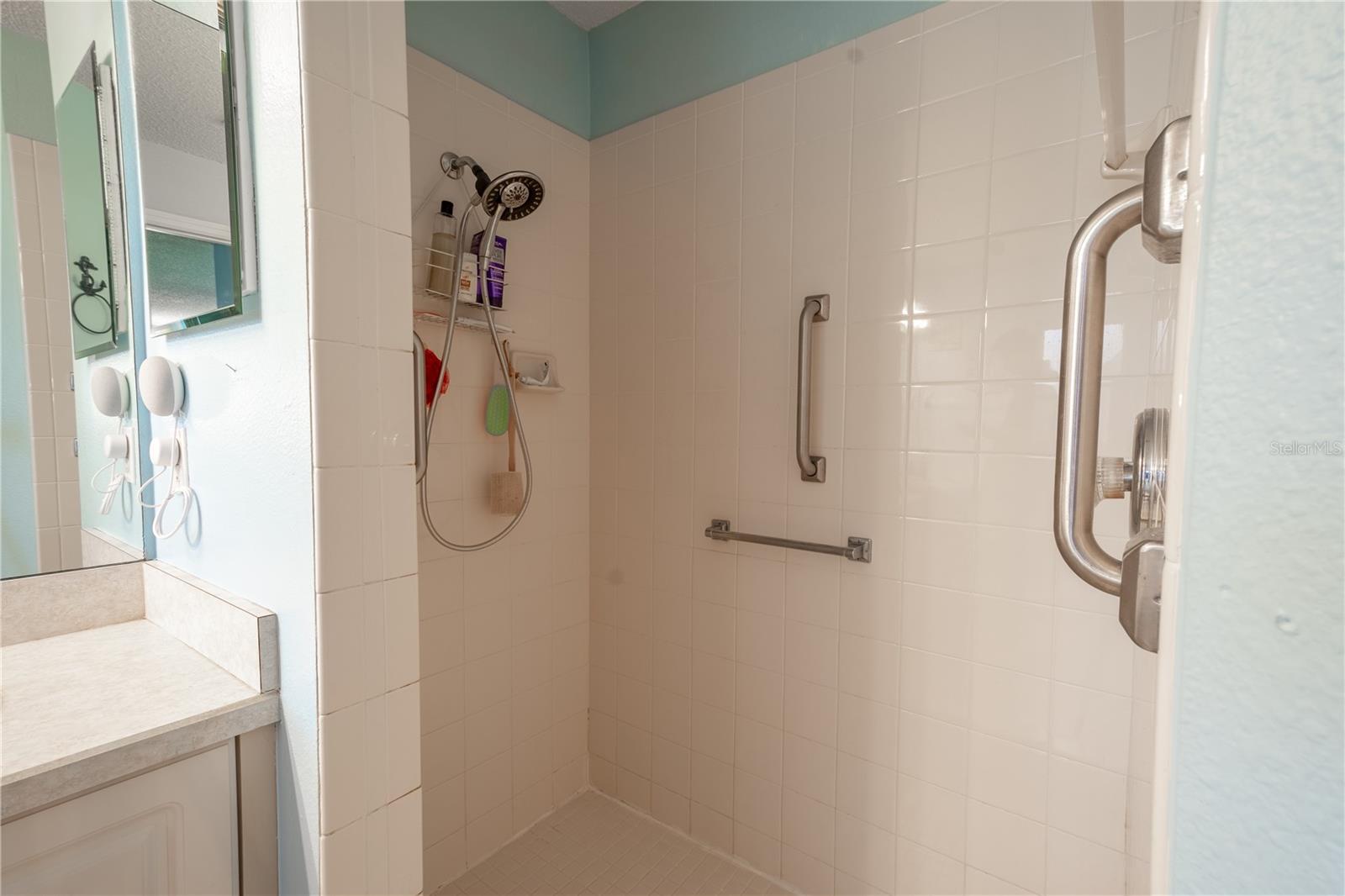 The primary bath features a tiled, walk in shower.