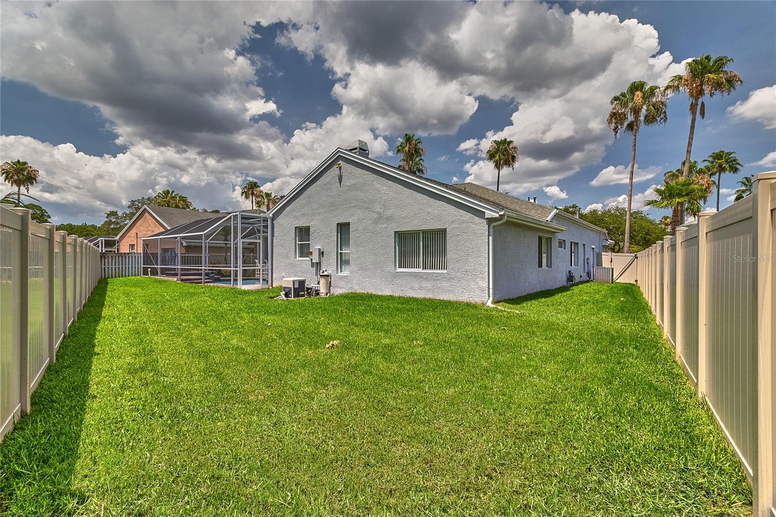 BACKYARD IN ADDITION TO THE POOL/PATIO ENTERTAINING SPACE